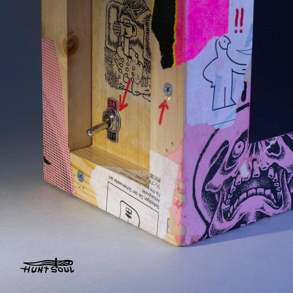 Close-up of handmade lightbox showing original art mounted on wood

