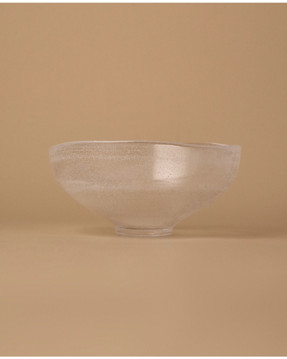 Thick translucent glass bowl with fine bubble texture